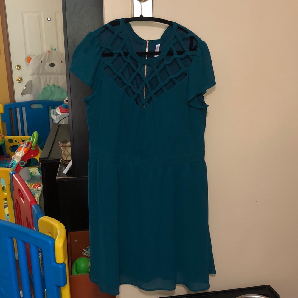 Teal cocktail dress with cage neckline